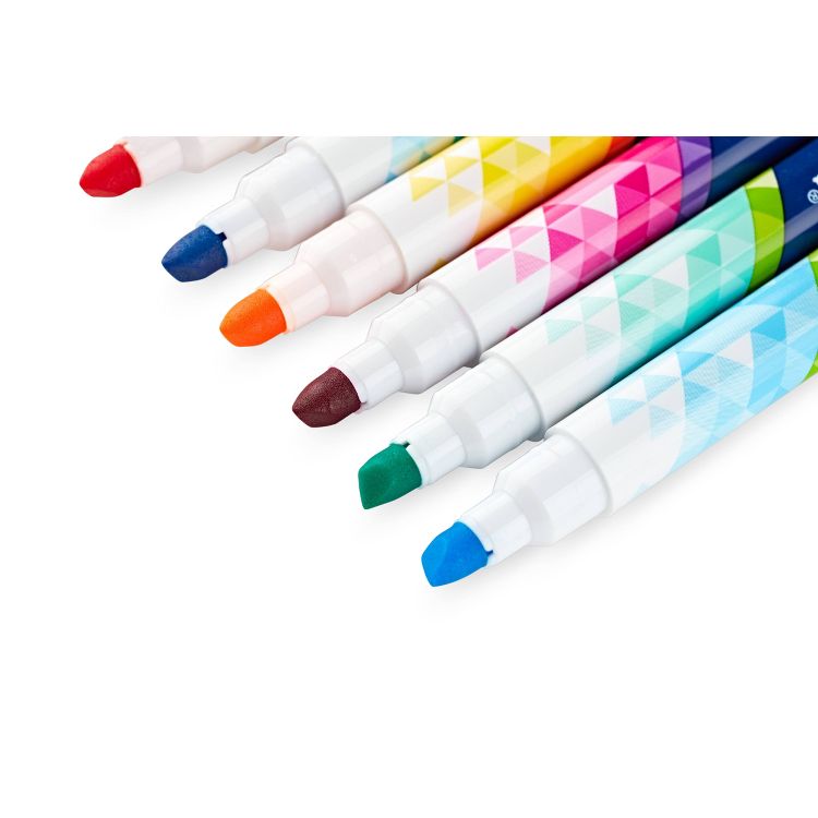 Seven markers with colored tips in red, blue, orange, brown, green, and light blue, featuring geometric patterns on the barrels.
