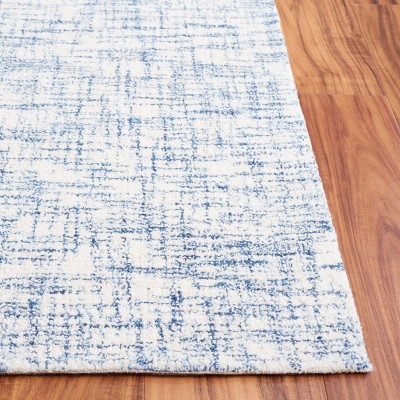 Ivory Tufted Handmade Wool Rectangular 6' x 9' Area Rug