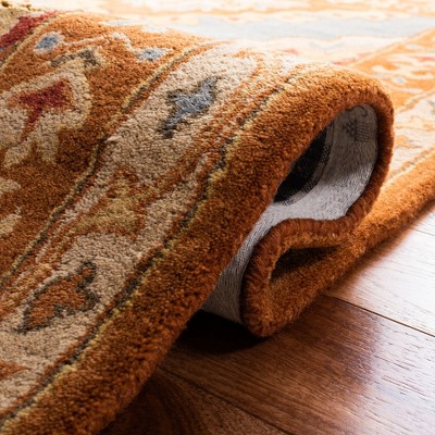 Hand-Tufted Blue and Rust Wool 5' x 8' Area Rug