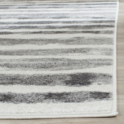 Ivory and Charcoal Striped 9' x 12' Easy-Care Synthetic Area Rug