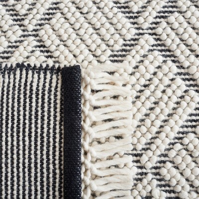 Handmade Black and Ivory Geometric Wool Rug, 2' 3" x 8'