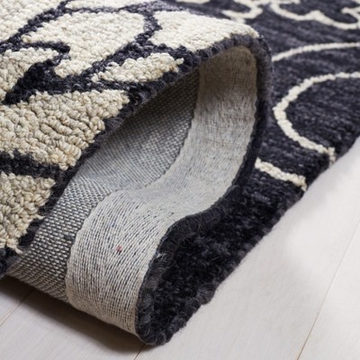 Handmade Black and Ivory Floral Wool Area Rug 3' x 5'