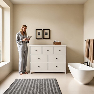 Luck Live The bathroom storage cabinet is 44.88 in ches in size, has seven drawers, and is in an off-white color.