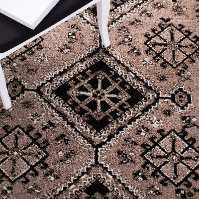 Elegant Antique Patina 5' x 7' Black Synthetic Area Rug