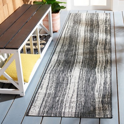 Courtyard Chic 26" Black Synthetic Non-Slip Easy Care Outdoor Rug