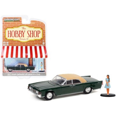 1965 Lincoln Continental Spanish Green w/ Tan Top & Woman in a Dress Figurine "The Hobby Shop" 1/64 Diecast Car by Greenlight