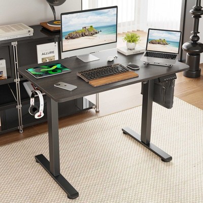 Desk in a home office with multiple devices