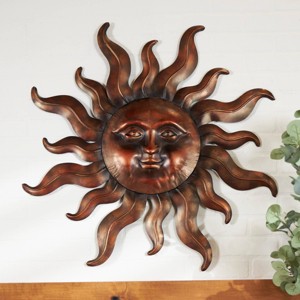 Metal Sun Wall Decor with Smiling Face and Curved Rays Copper - Olivia & May - 1 of 4