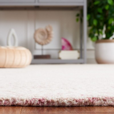 Ebony 5' x 8' Pink and Ivory Hand Tufted Wool Area Rug