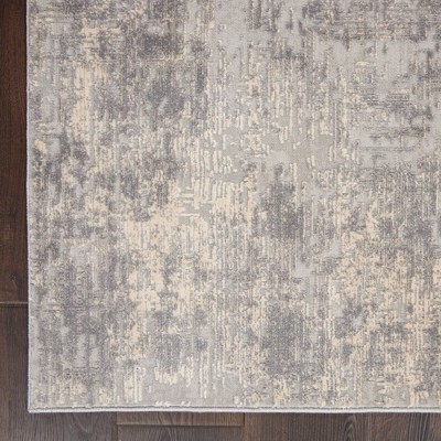 Ivory Abstract Power-Loomed Synthetic 5'3" x 7'3" Area Rug