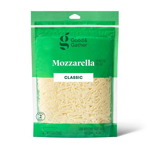 Shredded Mozzarella Cheese in a Plastic Container Stock Photo