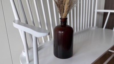 Amber Glass Bottle Vase with Black Wire Accent
