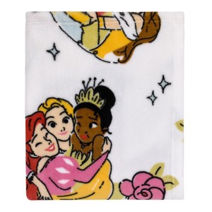 NoJo Disney Princesses Courage and Kindness Pink, Blue and White Ariel, Rapunzel, Tiana, Cinderella, Mulan, and Belle Super Soft Toddler Blanket - 1 of 4