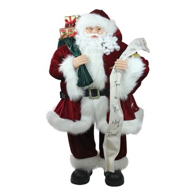 Northlight 36" Red and White Standing Santa Claus Holding a Naughty and Nice List Christmas Figurine