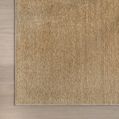 Pastel Orange Solid Machine Washable Synthetic Area Rug