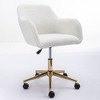 This swivel office chair is height-adjustable, has wheels, gold-plated legs, and a chrome-plated base. - 4 of 4