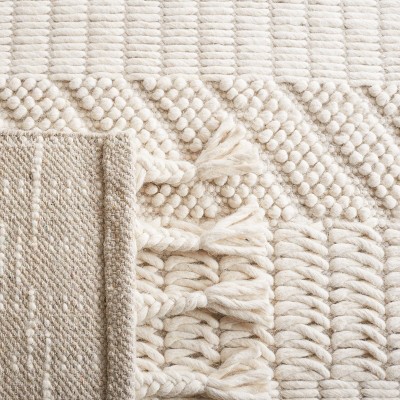 Ivory Handmade Wool Tufted 6' x 9' Area Rug