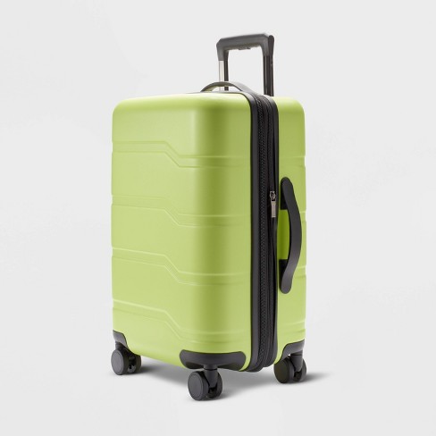 Green carry store on suitcase