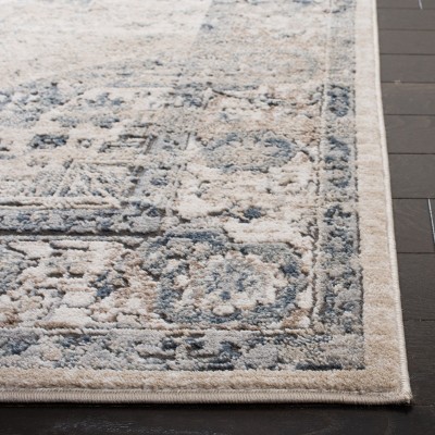 Ivory and Blue 10' x 14' Synthetic Stain-Resistant Rectangular Area Rug