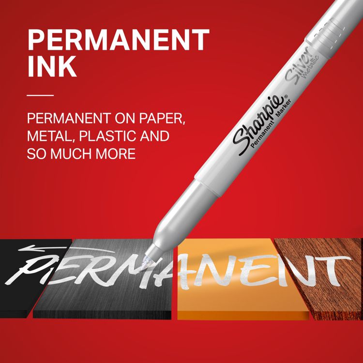 Silver colored permanent marker writing the word "PERMANENT" on different colored surfaces with text stating its use on paper, metal, plastic, and more.