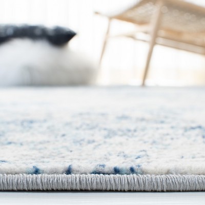 Ivory and Navy Square Synthetic Stain-Resistant Area Rug