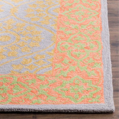 Ivory and Orange Floral Wool 8' x 10' Area Rug