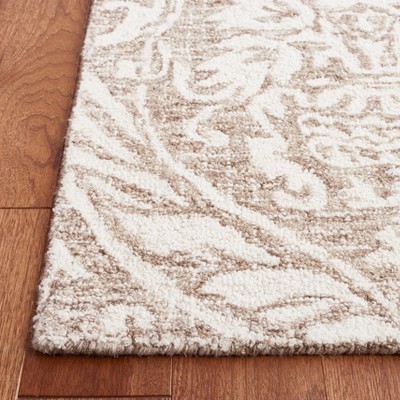 Ivory and Beige Abstract Wool 6' x 9' Handmade Tufted Rug