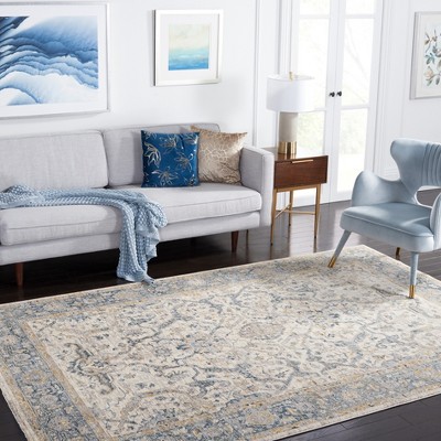 Ivory and Blue Synthetic Persian Style 5' x 8' Area Rug