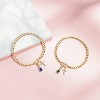 Free bird Cross Birthstone Bracelet | Dainty 14K Gold Plated Cross Charm Bracelet | Stretchable Elastic Gold Beaded Bracelet - 3 of 4