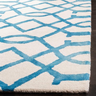 Ivory and Turquoise Hand-Tufted Wool 6' x 9' Area Rug