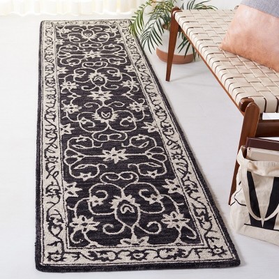 Handmade Black and Ivory Floral Wool Runner Rug