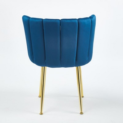 Back view of blue velvet dining chair with gold legs