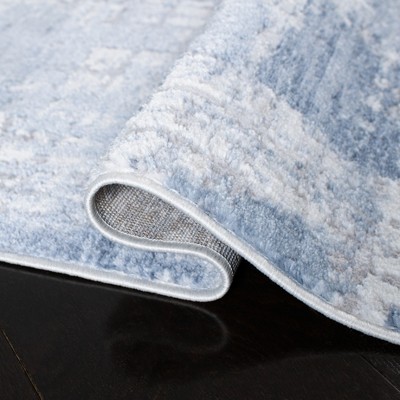 Ivory and Blue Abstract Synthetic Round Area Rug, 54"