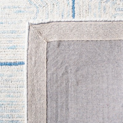 Ivory and Blue Handmade Abstract Wool Rug, 4' x 6'