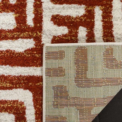 Ivory and Terracotta Geometric Synthetic Area Rug