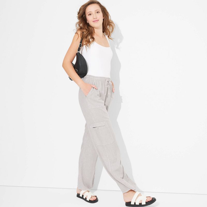 Women's Mid-Rise Wide Leg Vacation Cargo Pants - Wild Fable™, 1 of 7