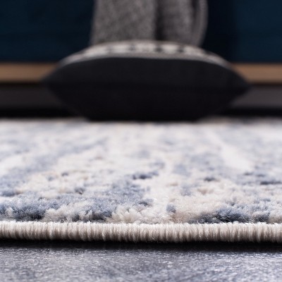 Ivory and Blue Abstract 8' x 10' Stain-Resistant Area Rug