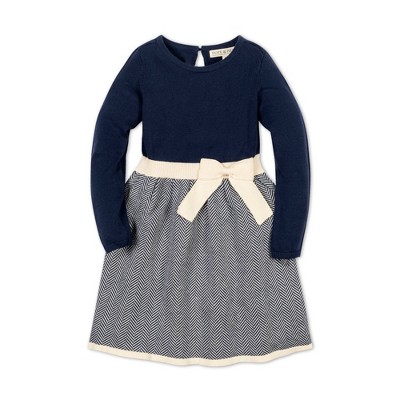Image of Hope & Henry Girls' Long Sleeve Skater Sweater Dress with Bow, Navy Herringbone Colorblock, 6-12 Months