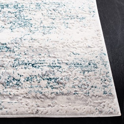 Cream and Turquoise Abstract Wool and Synthetic Area Rug, 3' x 5'