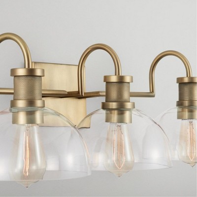 Aged Brass 3-Light Vanity with Clear Glass Domes and Dimmable Feature