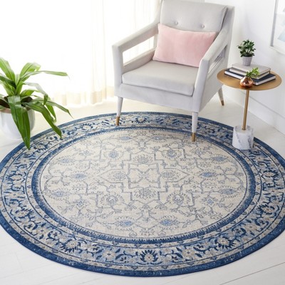 Ivory and Blue Round Hand-knotted Synthetic Rug