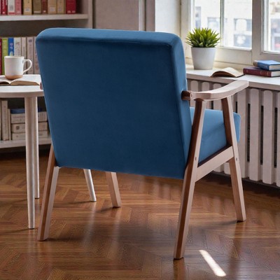 Blue upholstered chair seen from behind in a living room