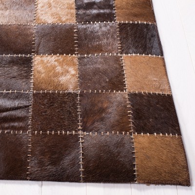 Handmade Brown and Beige Geometric Cowhide Area Rug