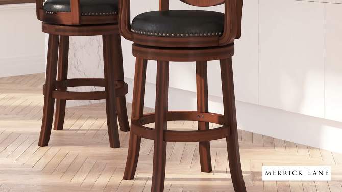 Merrick Lane 30" Swivel Bar Stool with Oval Rattan Back, Arms and Black Faux Leather Upholstered Swivel Seat in Espresso, 2 of 10, play video
