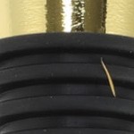 green, white, black, gold tone