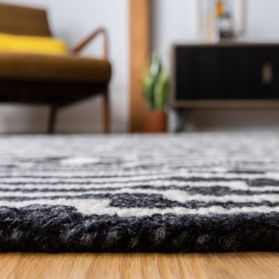 Ivory and Charcoal Round Tufted Wool Rug
