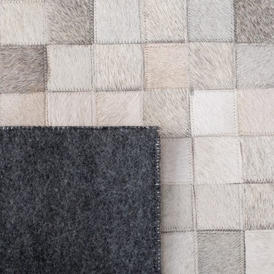 Handmade Black and Ivory Geometric Cowhide Area Rug