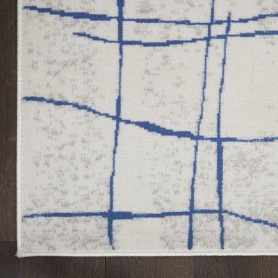 Ivory Abstract Linear 6' x 9' Machine-Made Synthetic Area Rug