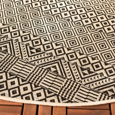 Beige and Black 4' Round Geometric Indoor/Outdoor Rug