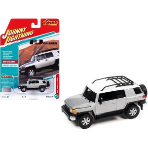 2007 Toyota FJ Cruiser Titanium Silver Metallic with White Top and Roofrack LTd Ed 1/64 Diecast Model Car by Johnny Lightning - 1 of 3